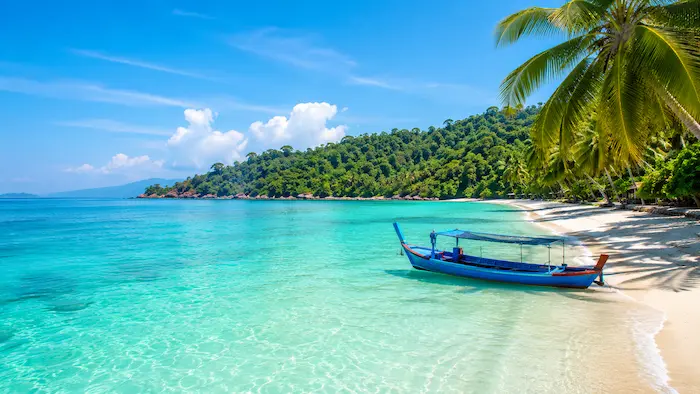 Relaxed Malaysia island beach day with boats and sunset