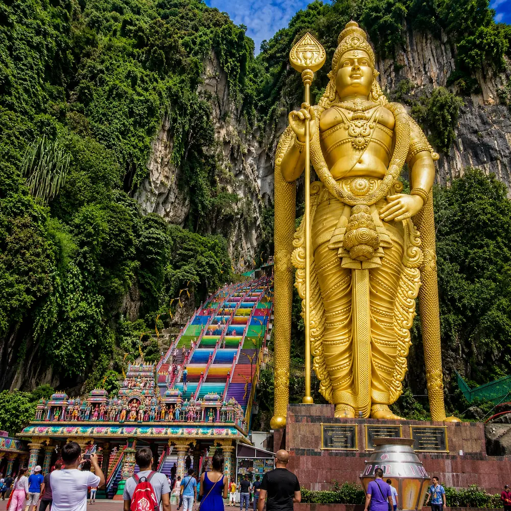 Tropical Malaysia coastline with rainforest hills and a bright travel skyline