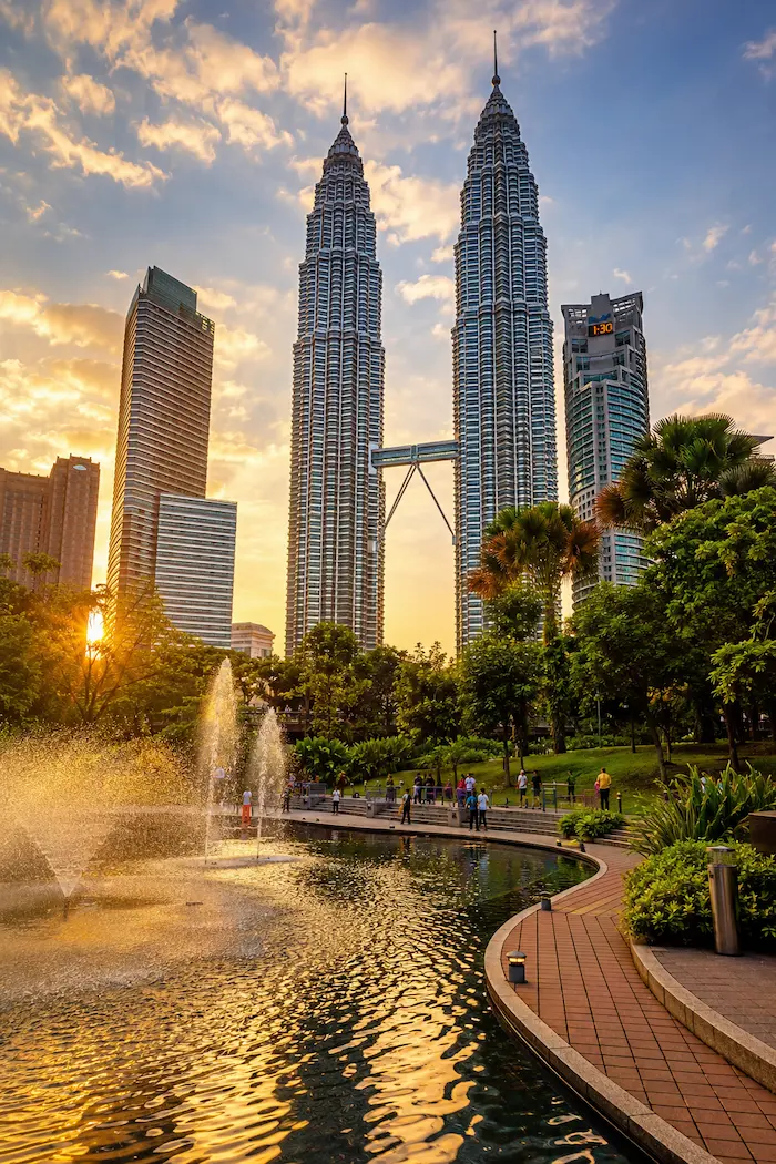 Kuala Lumpur skyline with tropical colors and landmark towers